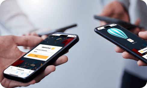 Two people look at the screen and cheer